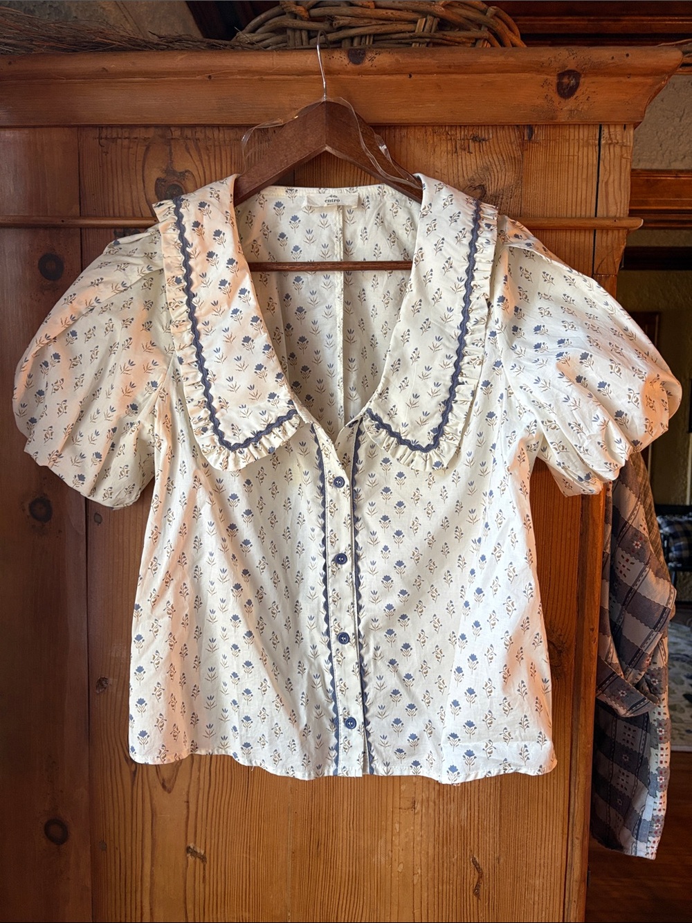 entro Cream Blouse with Blue Floral Print and Ruffle Collar